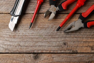 Wall Mural - Different electrical tools on wooden table, flat lay. Space for text