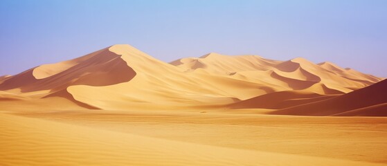 Wall Mural - Endless vistas of sunlit sand dunes stretch beneath a clear sky, exuding both the harshness and beauty of desert life.