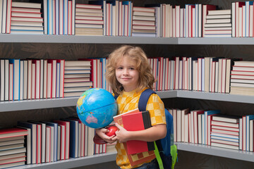 Fototapete - School boy with world globe and books. School kids. Child from elementary school. Pupil go study. Clever schoolboy learning. Kids study, knowledge and education concept.