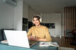 © Stock 4 You - Latin freelance woman in headphones using computer for online remote business studying watching webinar lesson. Smiling young hispanic female girl student getting knowledge remote on laptop pc at home