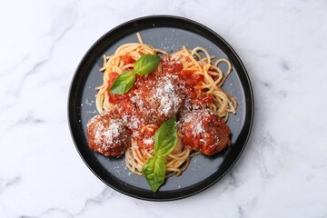 Wall Mural - Delicious pasta with meatballs, basil and cheese on white marble table, top view