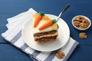 Wall Mural - Piece of delicious homemade carrot cake, walnuts and server on blue wooden table