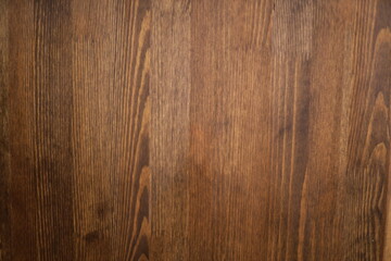 Poster - A close-up shot of a wooden table setting with a knife and fork, ideal for food photography or restaurant promotional materials.