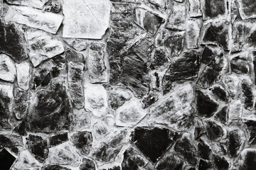 Poster - A close-up image of a stone wall in monochrome.