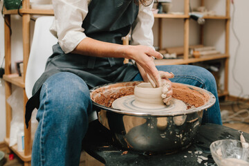 Poster - Process of making a unique ceramic shape. Potter creates a ceramic bowl in the pottery studio.