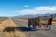 © Mind - Rustic Wooden Cart on Gravel Road, Wind Turbines and Mountains Under a Bright Blue Sky