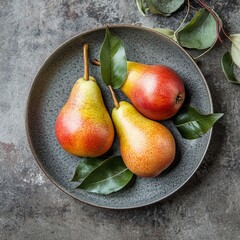 Canvas Print - Pear with leaves on a gray surface