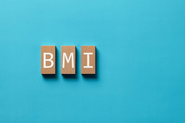Poster - There is wood block with the word BMI. It is an abbreviation for Brain Machine Interface as eye-catching image.