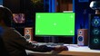 © DC Studio - Professional streamer looking at isolated screen monitor, competing in online videogame, streaming live at home. Mockup display used by man playing on PC, using headphones to talk
