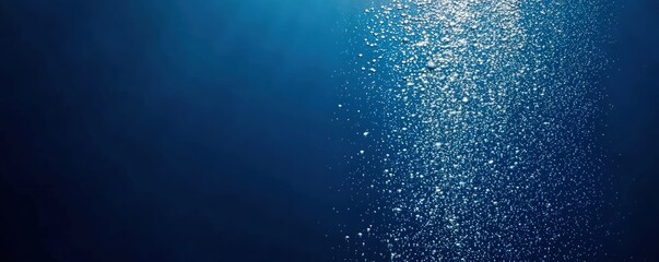 Poster - A serene underwater scene featuring shimmering bubbles rising in deep blue water, creating a tranquil and peaceful atmosphere.
