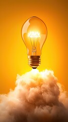 Poster - glowing light bulb floating in a cloudy orange hued environment representing an innovative idea crea