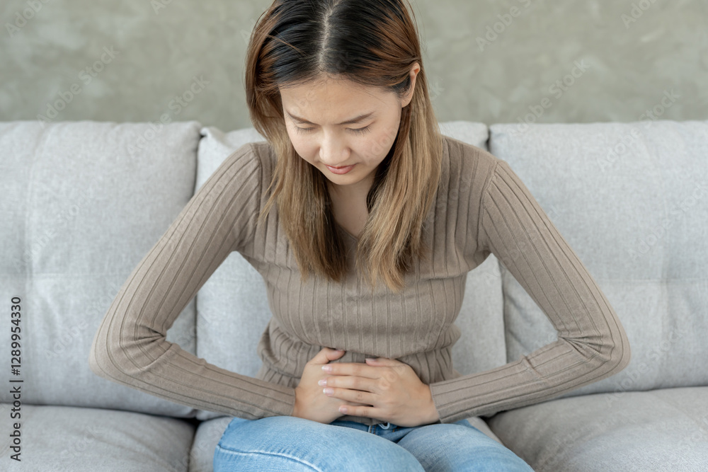 stomach ache. Asian women have abdominal pain, indigestion, gastritis