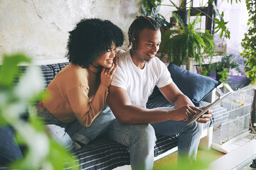 Poster - Relax, home and couple on sofa with tablet for internet, online shopping or streaming website. Dating, weekend and African man and woman on digital tech for social network, bonding and connected