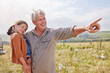 © peopleimages.com - Farm, pointing and grandpa with child in nature with animals, livestock or poultry. Agriculture, chickens and grandfather with girl with free range birds for protein, food industry and sustainability