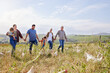 © peopleimages.com - Family, children and holding hands at farm, chicken and walk in field, summer or outdoor for bonding in countryside. People, kids and connection for poultry, meat or egg production with love in Spain