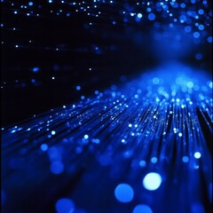 Leinwandbilder - Blue Lights: Abstract Sparkle and Flow of Dazzling Optical Fiber Technology on a Dark Background. 