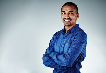 Poster - Happy, businessman and portrait with confidence in studio for career in design on a gray background. Man, employee designer or model with smile or arms crossed for company startup on mockup space