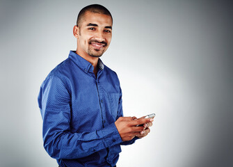 Poster - happy, portrait or businessman with phone in studio for communication, text or chat on a gray backgr