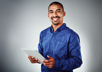 Poster - Happy, portrait and businessman with tablet for creative design, research or project on a gray studio background. Male person, model or employee with smile on technology for online app, UI or UX