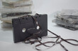 © Reno - stock photo of technology; pile of audio tape cassettes scattered around on a white background: cassettes were a very popular sound recording medium in the 80s to late 90s.
