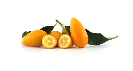 Wall Mural - Fresh kumquats with leaves showing the inside on white background