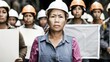© han - Group of workers standing in front of a factory, holding blank signs, expressing frustration and disagreement, highlighting labor issues and workplace conflicts.