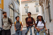 © bernardbodo - Happy tourists walking through the streets of lisbon, portugal