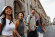 © bernardbodo - Happy tourists walking and exploring city center