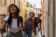 © bernardbodo - Happy tourists holding hands exploring lisbon, portugal