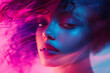 © ALL YOU NEED studio - Close-up portrait of a young woman with dark, curly hair illuminated by vibrant, surreal lighting that bathes the scene in bold hues of electric blue and magenta.