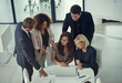 © ThurstanJam/peopleimages.com - Discussion, business meeting and people with laptop, online and brainstorming with technology. Boardroom, colleagues and group with info for project, planning and teamwork for ideas or top view