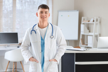 Wall Mural - Male medical intern near reception desk in clinic