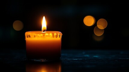 Aufkleber - A solitary candle emits a gentle flicker, illuminating its surroundings in soft orange hues. The tranquil glow creates a cozy atmosphere, perfect for relaxation or meditation during evening hours