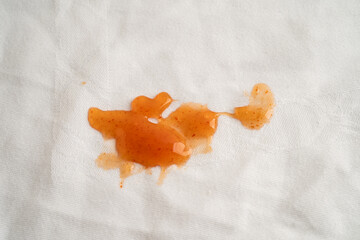 dirty tomato sauce stain or ketchup on cloth to wash with washing powder, cleaning housework.