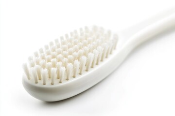 Poster - Close-up shot of a toothbrush on a clean white surface