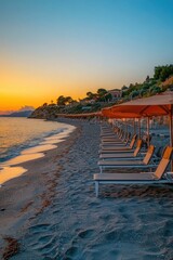 Aufkleber - Lounge chairs and umbrellas on a peaceful beach during sunset, ideal for relaxing vacations or tropical getaways
