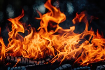 Wall Mural - A close-up shot of flames on a grill, ideal for use in food or cooking-themed projects