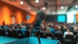 © Selvi - Close Up of a Microphone on a Podium in a Blurred Conference Room