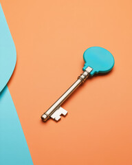Poster - Key closeup in studio room with orange background, abstract design.