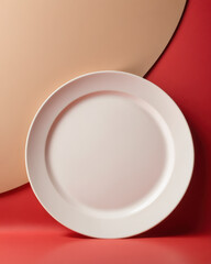 Poster - Plate on red backdrop with beige studio background creating a bold contrast.