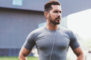 Serious runner preparing for sport exercise in street