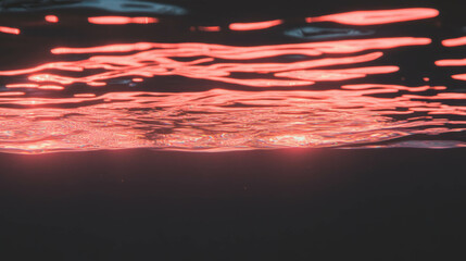 Poster - Tranquil water surface with reflected red light for background or design
