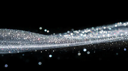Poster - Shimmering silver bokeh with bright white sparkle on black background for festive designs