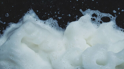 Poster - White foam texture on dark background for creative design projects