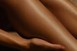 © Mirrorstudio - Close-up of female hands massaging smooth legs. Skin care, sun protection