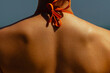 © Mirrorstudio - Female back in orange bikini under sunlight. Skin care, sun protection