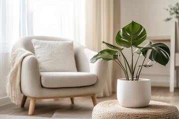 Wall Mural - A large monstera plant in a sleek white ceramic pot, placed beside a minimalist gray armchair in a bright modern living room