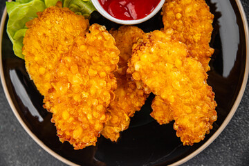 Wall Mural - Chicken nuggets deep fried breaded food dish fresh tasty gourmet food background on the table rustic food top view copy space