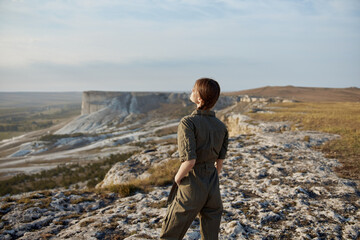 Wall Mural - Woman standing on cliff overlooking valley and mountains, wanderlust adventure travel concept view landscape beauty hike trip explorer