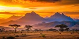 Golden Hour Panorama Serene African Savanna at Sunset with Majestic Mountain Range